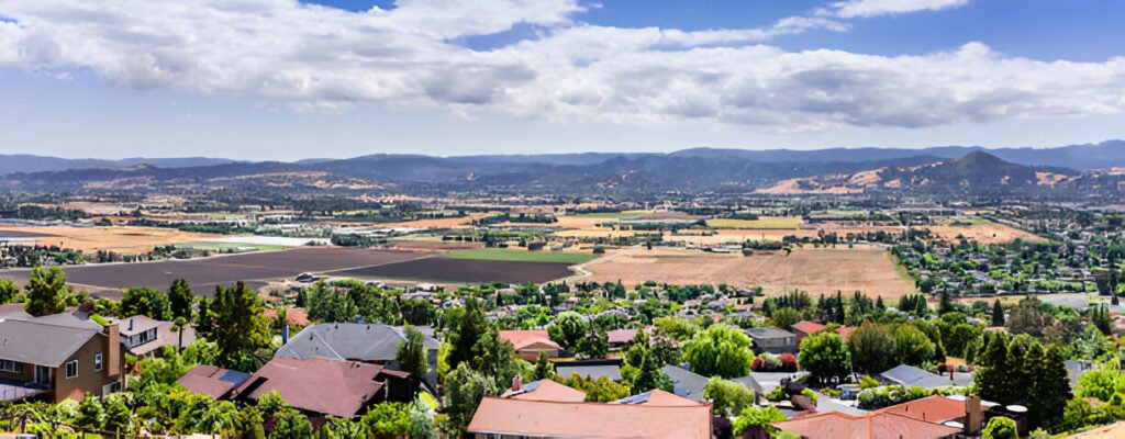 A scenic residential view in Morgan Hill, CA, showcasing homes and the surrounding landscape.