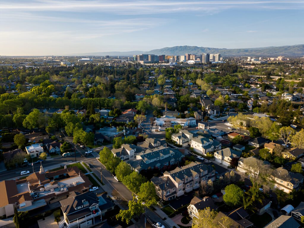 Aerial view of Sunnyvale, California, showcasing a suburban community, residential neighborhoods, and a thriving real estate market.
